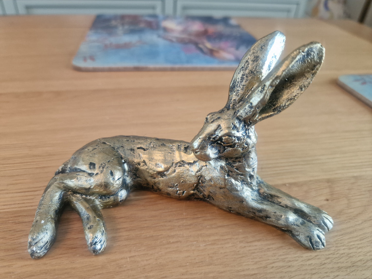 Lounging Hare Bronze Finish Sculpture . H10cm