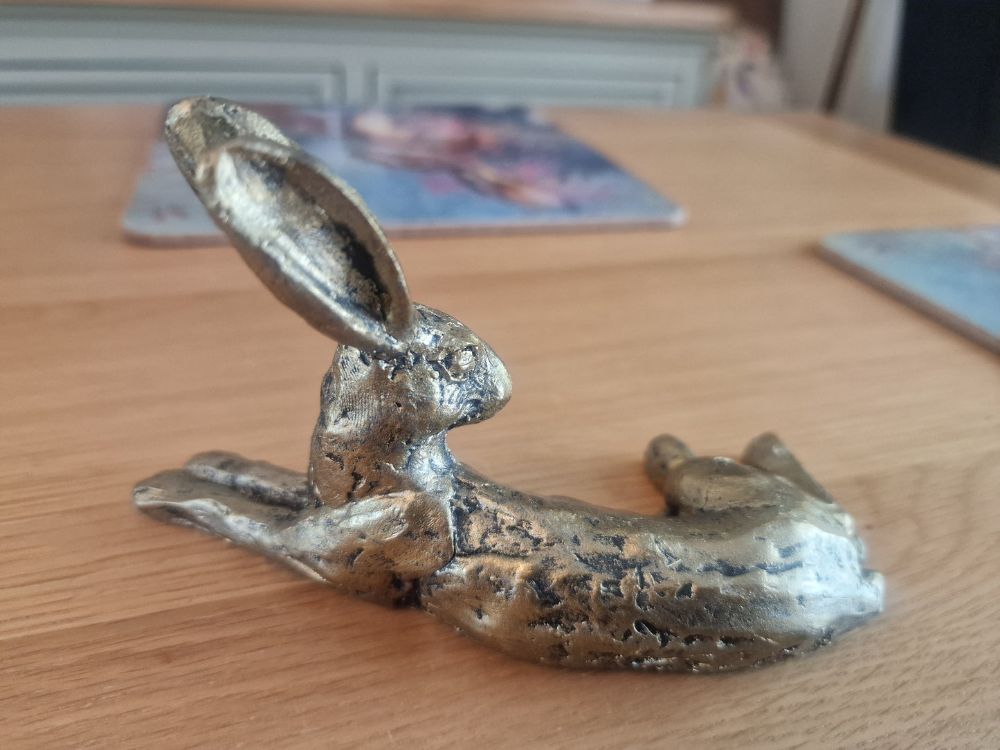 Lounging Hare Bronze Finish Sculpture . H10cm