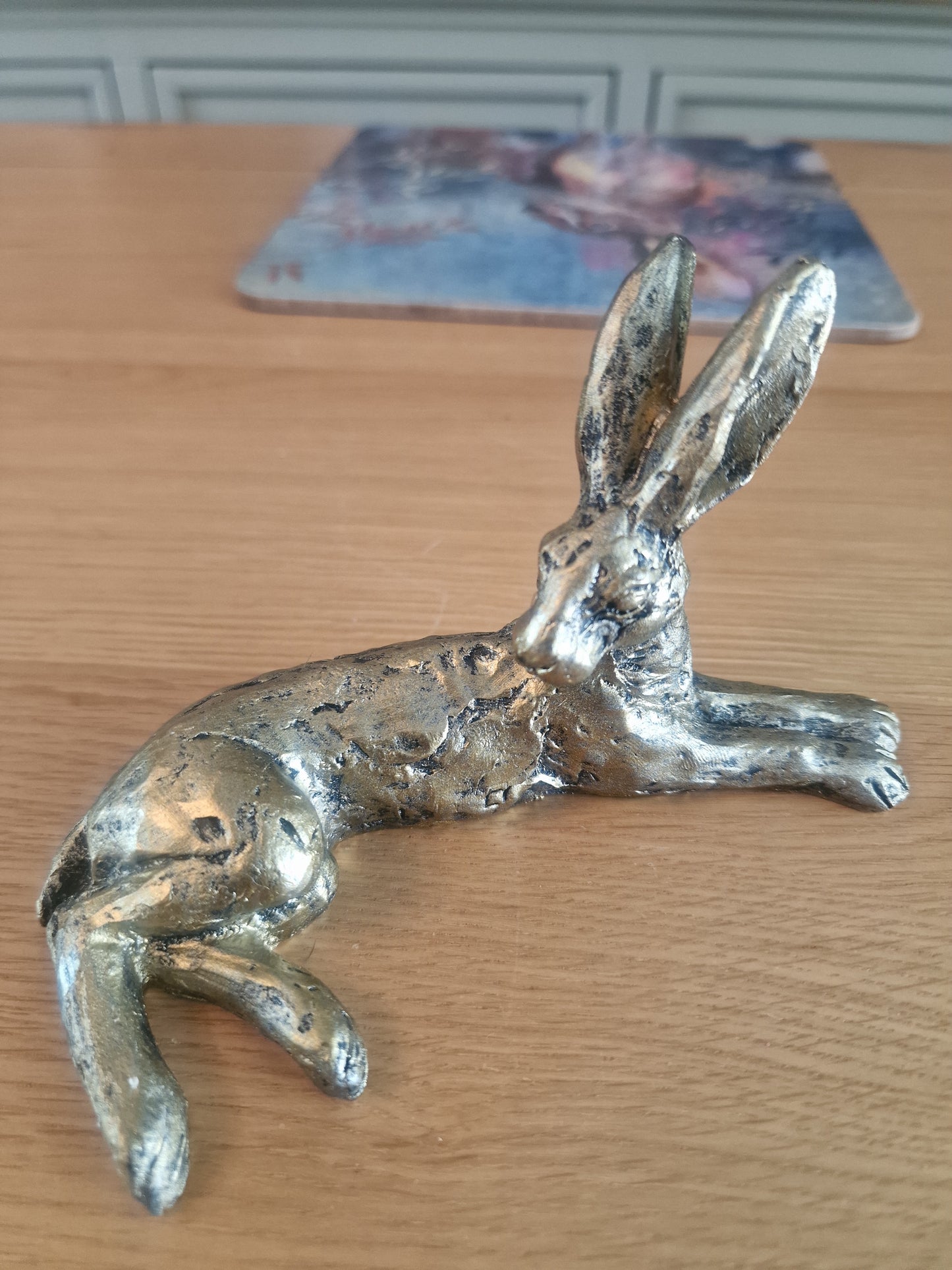 Lounging Hare Bronze Finish Sculpture . H10cm