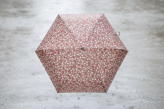 Taupe floral umbrella - rainy street lifestyle